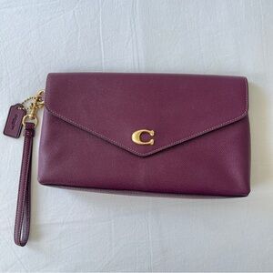 Coach Plum Wristlet with Gold Hardware